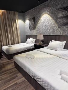 Postel nebo postele na pokoji v ubytování Swing & Pillows - KLIA 1 KLIA 2, Sepang