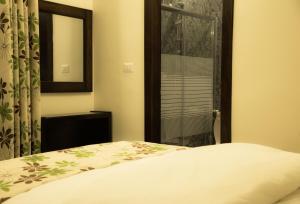 Katil atau katil-katil dalam bilik di Shams Alweibdeh Hotel Apartments
