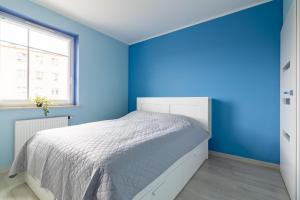 Postel nebo postele na pokoji v ubytování Apartament Olsztyn Rataja 62