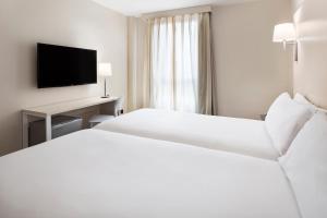 Postel nebo postele na pokoji v ubytování B&B HOTEL Castellón