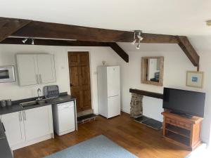 Kuchyň nebo kuchyňský kout v ubytování Millers Cottage