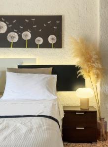 Postel nebo postele na pokoji v ubytování Pancratium #4 Seaside Apartment