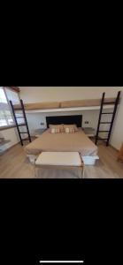 two beds in a room with two chairs at CH036 Casa linda de playa in San José de Guatemala