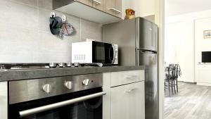 Η κουζίνα ή μικρή κουζίνα στο M393 - Marcelli, nuovo quadrilocale a 200mt dal mare