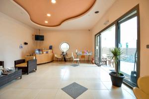 a living room with a couch and a table at Avra Hotel in Ormos Panagias