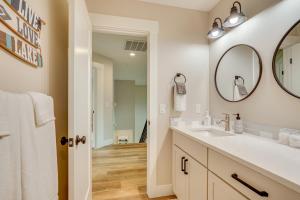 a bathroom with a sink and a mirror at Spacious Donnelly Family Home with Private Hot Tub! in Donnelly +33 photos