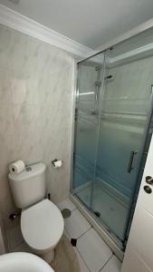 a bathroom with a toilet and a glass shower at Apartment in the center of Fuengirola in Fuengirola