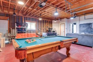 a living room with a pool table in it at Modern Fischer House with Deck, Fire Pit and Hot Tub! in Fischer