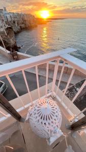 a view of the sunset from a cruise ship at Bella Vista Grotta Ardito in Polignano a Mare