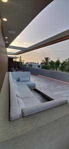 a living room with a couch on a roof at Summertime Signature Suites in Agia Marina Nea Kydonias