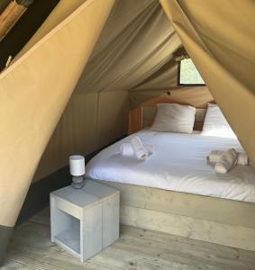 a bedroom with a bed in a tent at Camping Santa Elena in Lloret de Mar