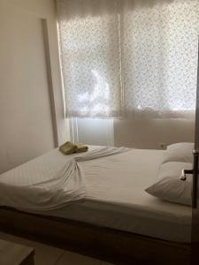 En eller flere senge i et værelse på MİNA GRAND HOTEL