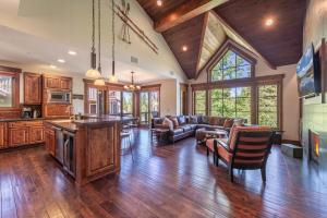 a large living room with a couch and a table at Luxury Northstar Home Walk to Lifts Private Hot-Tub Fenced-In Yard Book on Mobile for Promo Price in Truckee