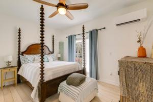 a bedroom with a bed and a ceiling fan at Beach Dreams Resort in Bradenton Beach