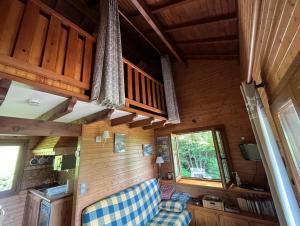 Posezení v ubytování Chalet entier, vue panoramique, ruisseau et sauna.