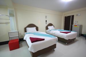 Postel nebo postele na pokoji v ubytování Windsor Resort
