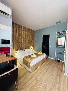 מיטה או מיטות בחדר ב-Colombia Apartments&Rooms