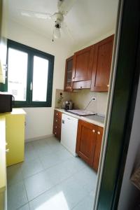 Kuchyň nebo kuchyňský kout v ubytování Casetta Le Dune, 5 min a piedi dal mare