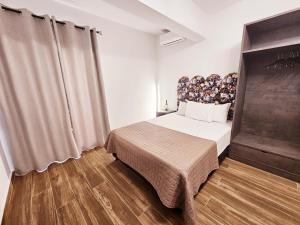 Postel nebo postele na pokoji v ubytování Sunrise Rooms