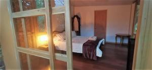 Postel nebo postele na pokoji v ubytování Hotel Campestre Rocas Del Paraíso