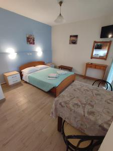 Postel nebo postele na pokoji v ubytování Villa Avra
