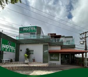 a building with a hotel rover sign on top of it at Hotel Trevo Caruaru in Caruaru