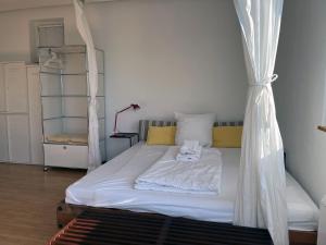 a bedroom with a bed with a canopy at Marina Studio Bregenz - See & City in Bregenz