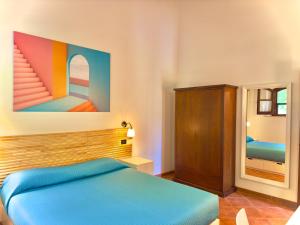 Postel nebo postele na pokoji v ubytování Pianferrari Agriturismo in Maremma