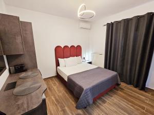 Postel nebo postele na pokoji v ubytování Sunrise Rooms