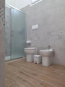 a bathroom with a toilet and a bidet at MAYU'S HOUSE , Dimora nel centro storico di Lecce in Lecce +82 photos