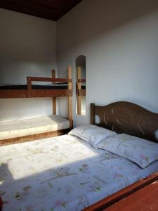 Llit o llits en una habitació de Chácara, próx a SP, com WI-FI e uma vista incrível