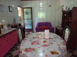 a kitchen with a table with a candle on it at CASA CHARMING Espaço Pedrina in Mairiporã