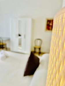 A bed or beds in a room at Minturnae Hotel