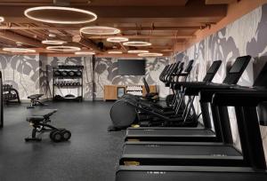 a room with a bunch of exercise bikes and a tv at Sandbourne Santa Monica, Autograph Collection in Los Angeles