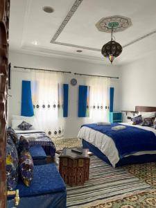 Postel nebo postele na pokoji v ubytování Riad Blue Oasis
