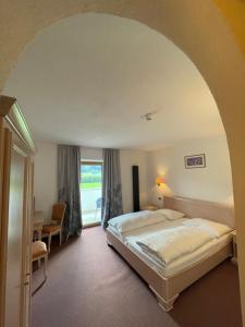 Voodi või voodid majutusasutuse Hotel Larch toas