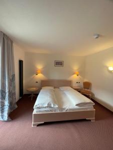 Voodi või voodid majutusasutuse Hotel Larch toas