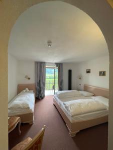 Voodi või voodid majutusasutuse Hotel Larch toas