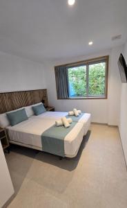 Postel nebo postele na pokoji v ubytování Hostal Rambla 24 by Holihome