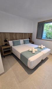 Postel nebo postele na pokoji v ubytování Hostal Rambla 24 by Holihome