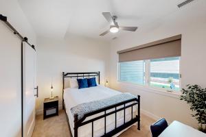 a bedroom with a bed and a window at Yampa Valley Escape in Steamboat Springs +32 photos