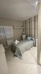 Giường trong phòng chung tại Apartamento acogedor