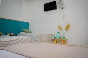 Postel nebo postele na pokoji v ubytování La Puerta del Ángel Isla