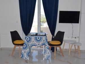 TV a/nebo společenská místnost v ubytování Gemini Apartment