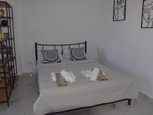 Postel nebo postele na pokoji v ubytování Gemini Apartment