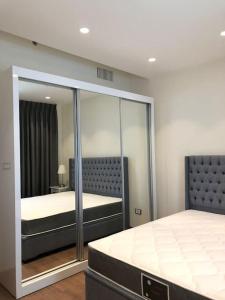 Postel nebo postele na pokoji v ubytování Luxury 1 BR Apt DAMAC Abdali