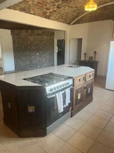 a kitchen with a stove and a sink at Casas Rio Mulege in Mulegé +50 photos
