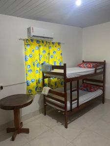 Ένα ή περισσότερα κρεβάτια σε δωμάτιο στο Aconhengo do Altíssimo