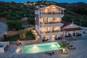 an aerial view of a villa with a swimming pool at Art Studios in Neos Marmaras