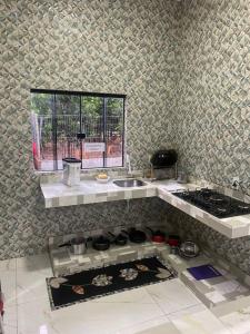 Η κουζίνα ή μικρή κουζίνα στο Aconhengo do Altíssimo